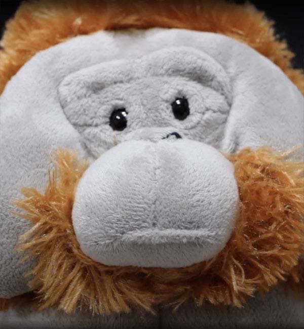 Screenshot of 'Waiting for the Centrifuge' short film, depicting a stuffed animal orang-utan