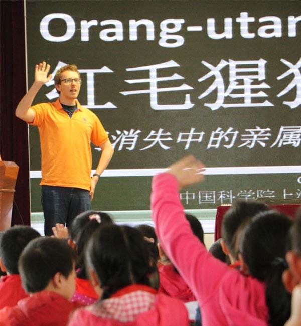 Photo of Dr Banes presenting at a Chinese elementary school